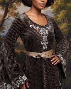 Model wearing the vegan leather belt over a velvet gown