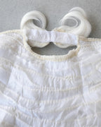 Inside of the white wig showing the lace cap and elastic band