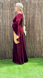 Side view of the burgundy stretch velvet gown