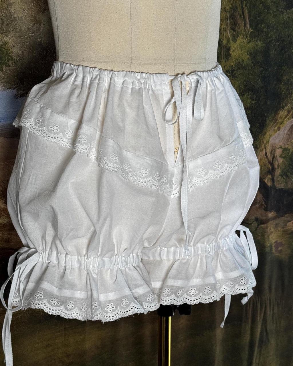Bloomers on a dress form with the legs gathered short