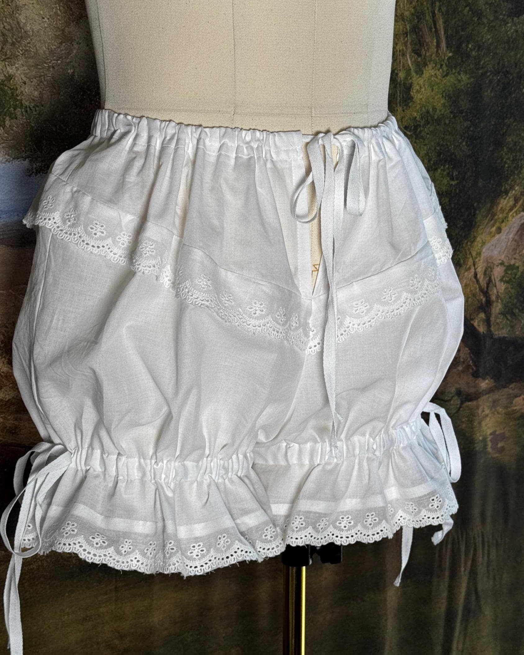 Bloomers on a dress form with the legs gathered short