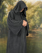Grey fleece hooded robe worn with the hands clasped