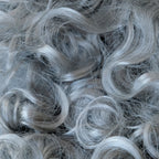 Close-up of the snowy grey synthetic curls