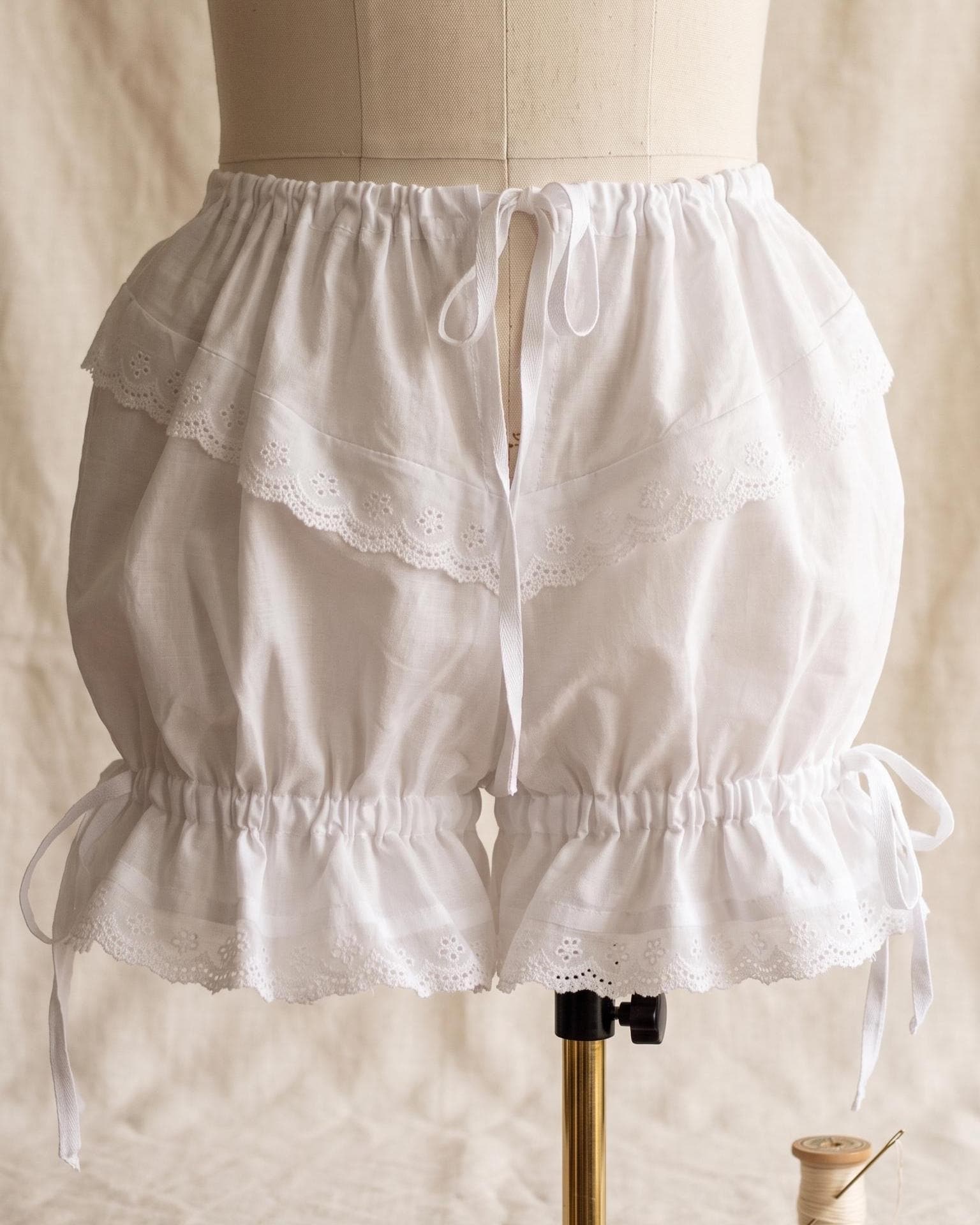 Bloomers on a dress form showing the drawstring waist
