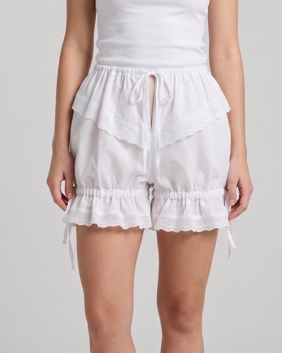 Woman wearing the white cotton bloomers with lace-trimmed legs