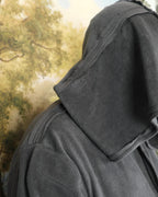 Close-up of the grey robe's hood and shoulder seam