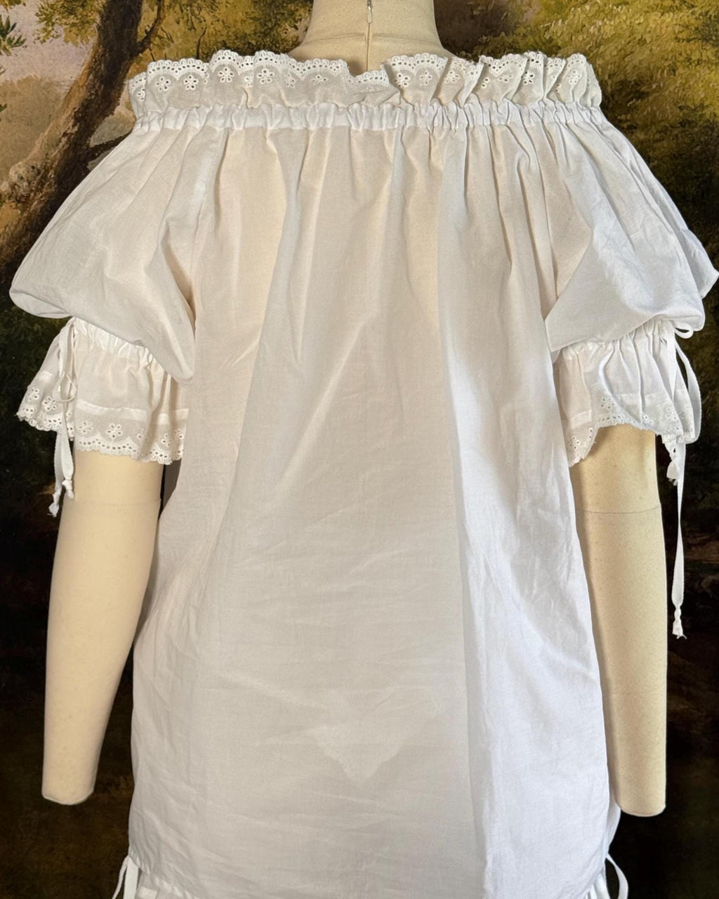 Back view of the white batiste chemise on a dress form