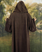 Back of the brown robe with the oversized hood raised