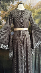 Back lacing and cream belt of the sage grey-green medieval dress