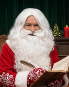 Santa reading a book, wearing the white beard and wig set