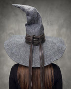 Grey pointed felt hat with long ribbon ties, front view