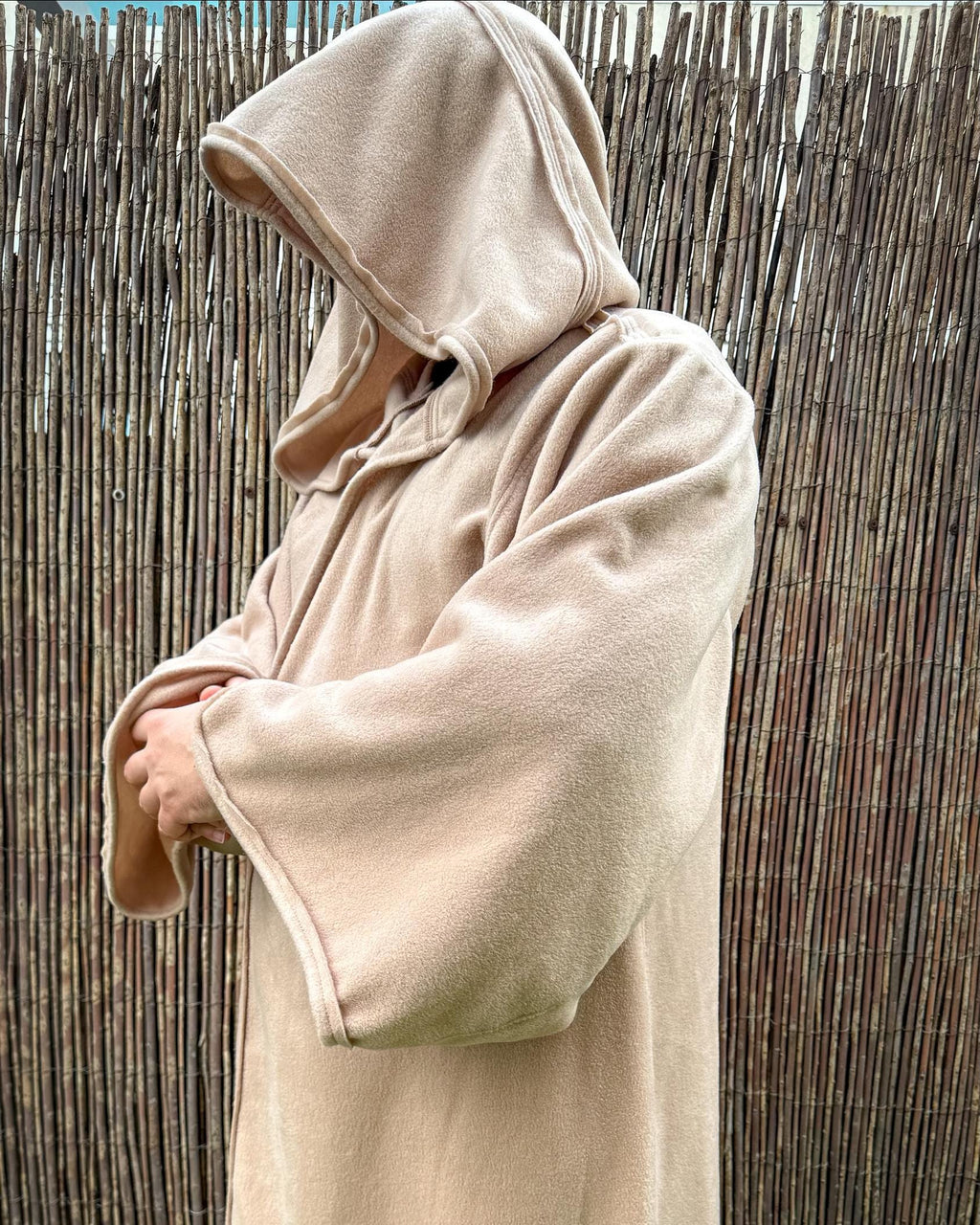 Beige fleece hooded robe seen from the side