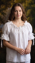 Woman wearing the white cotton batiste chemise with lace trim