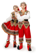 Man and woman in matching red folk elf costumes