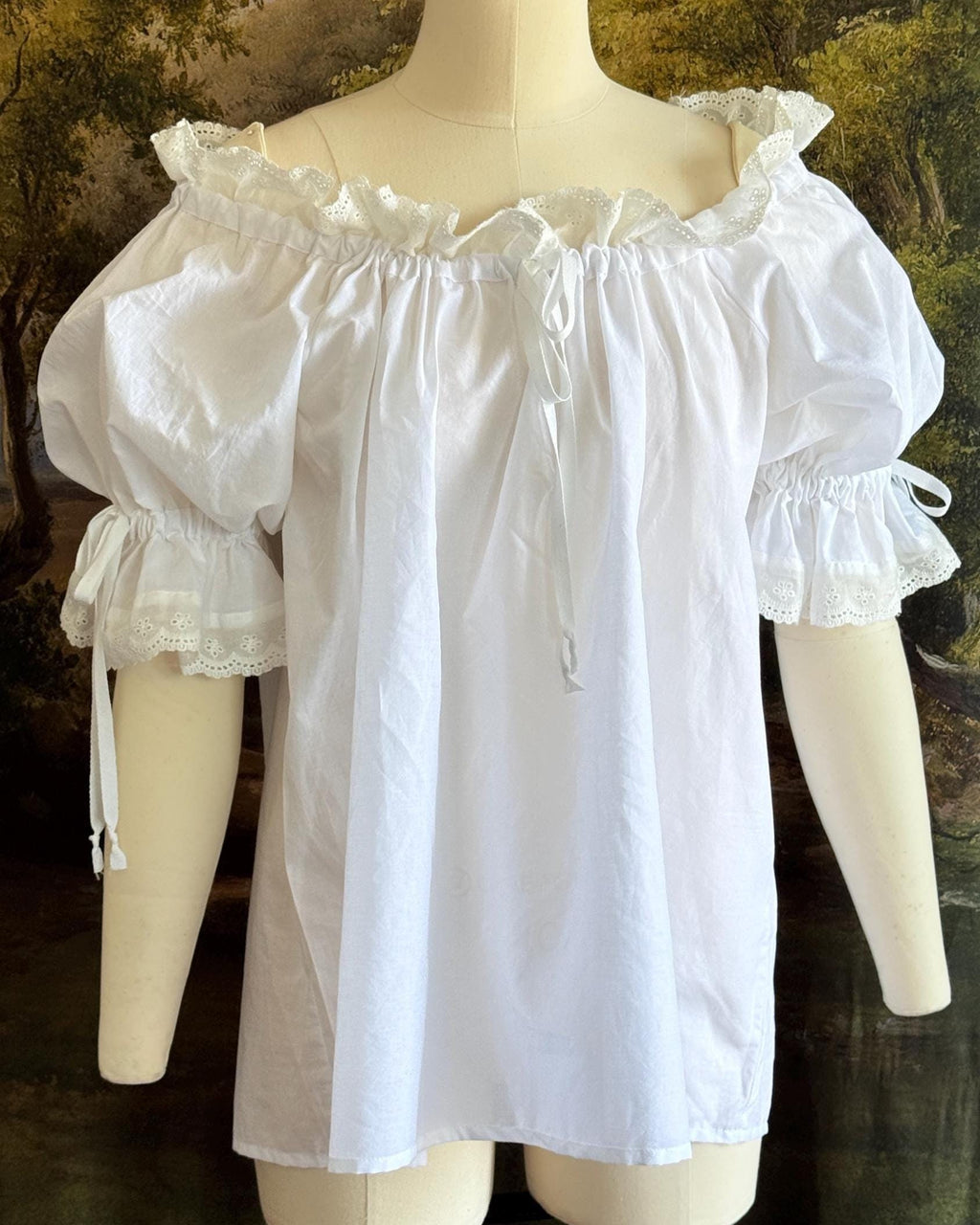 Chemise with the elasticated neckline pulled wide off the shoulder