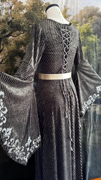 Lace-up back of the sage velvet gown with beaded tasselled ties