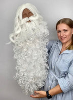 Maker holding the longest white Santa beard for scale
